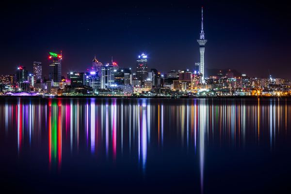 NZAKL Auckland city buildings next to sea water during night Samuel Ferrara.jpg